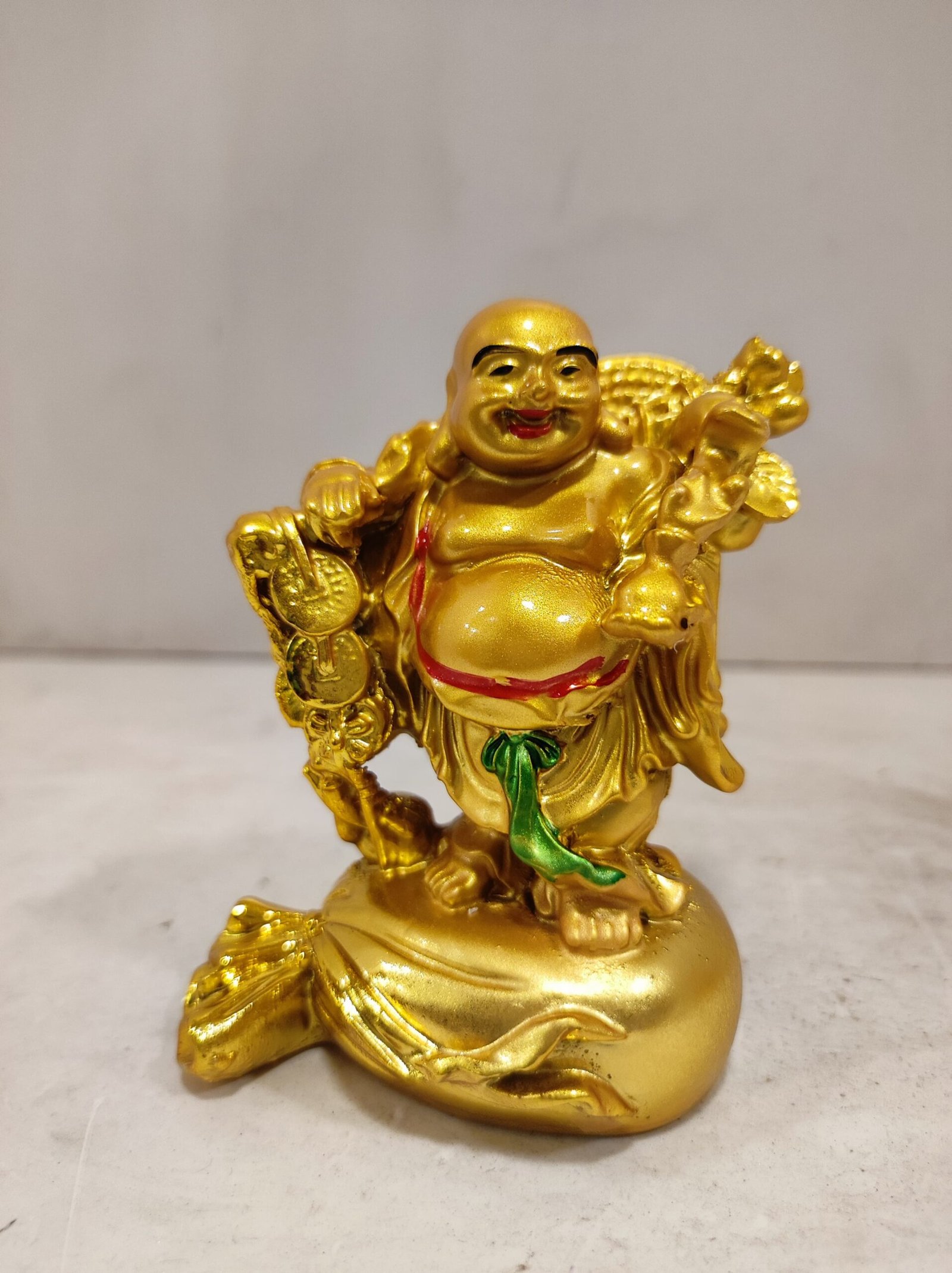 Fengshui golden laughing buddha on sack