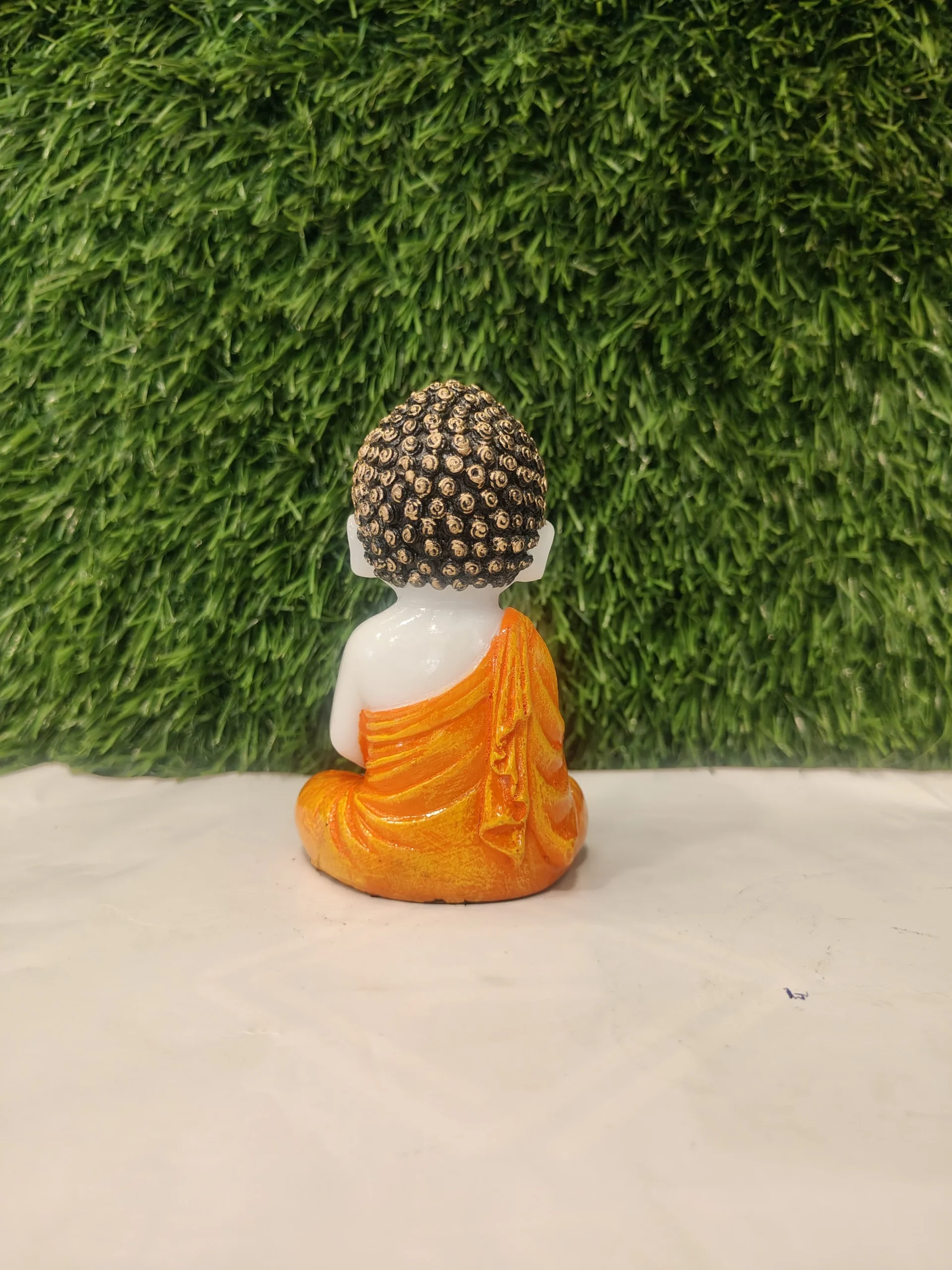 Flower Holding Baby Monk Figurine – Orange & White | 4.5 Inch - Image 1